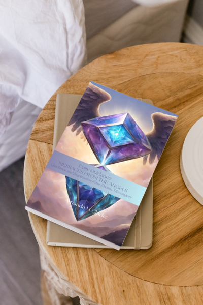 Book with a colorful cover featuring geometric shapes on a wooden surface.